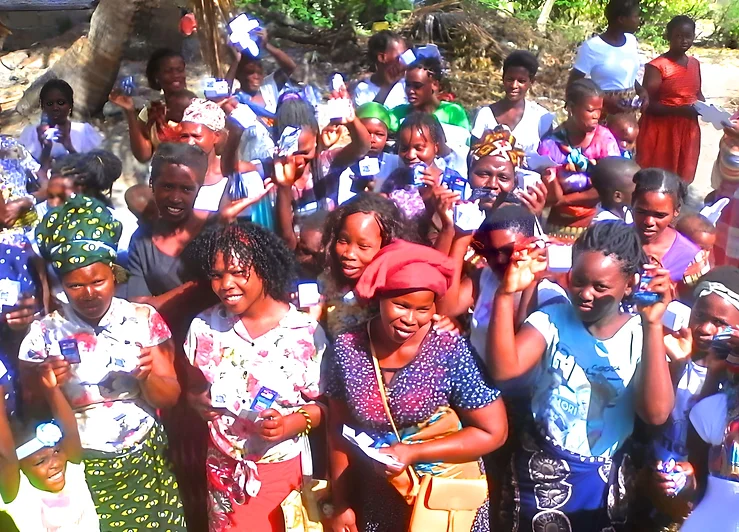 Distributing AMANZI products among local communities (Mozambicans)