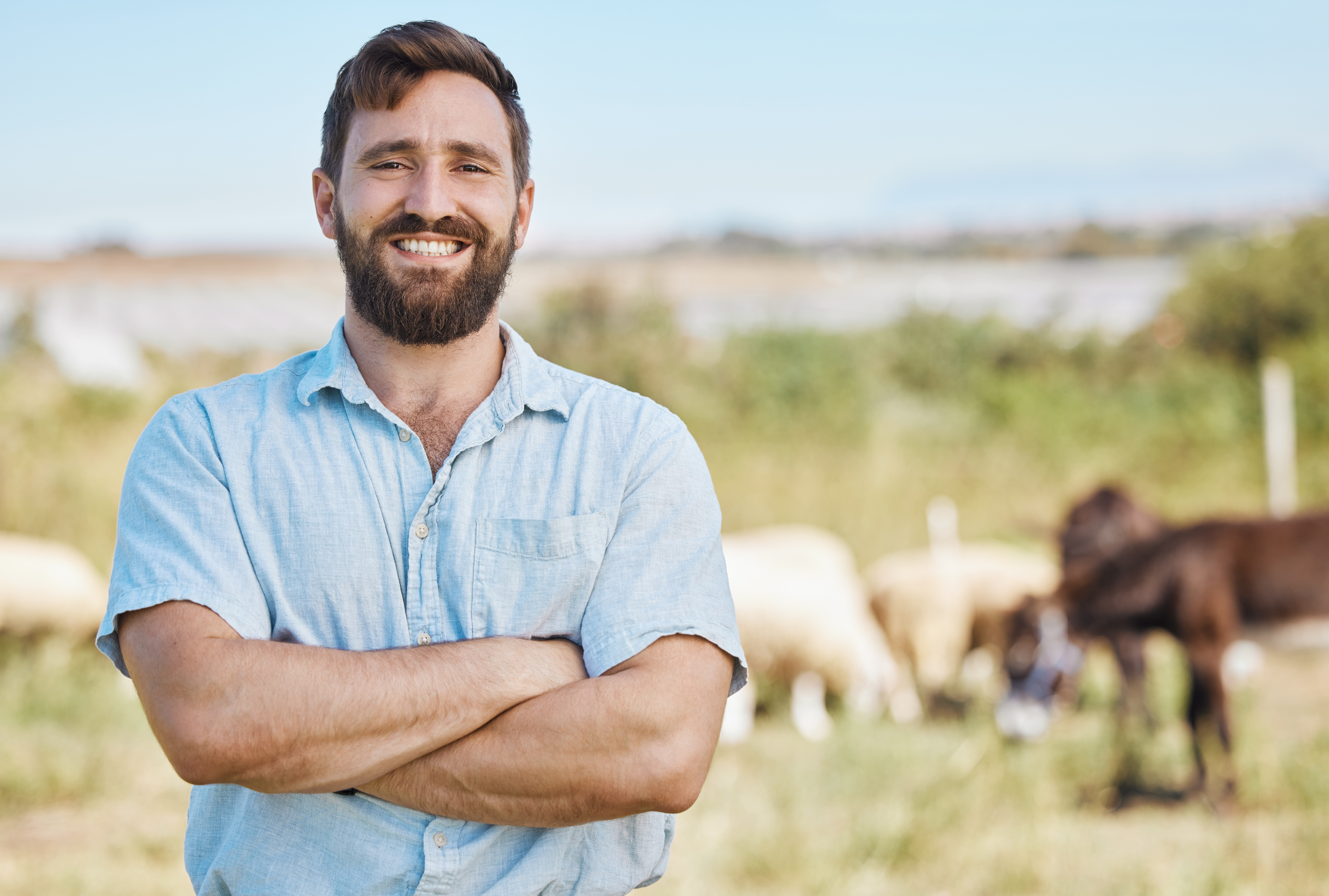 Farmer, portrait or arms crossed on livestock agriculture, sustainability environment or nature lan.